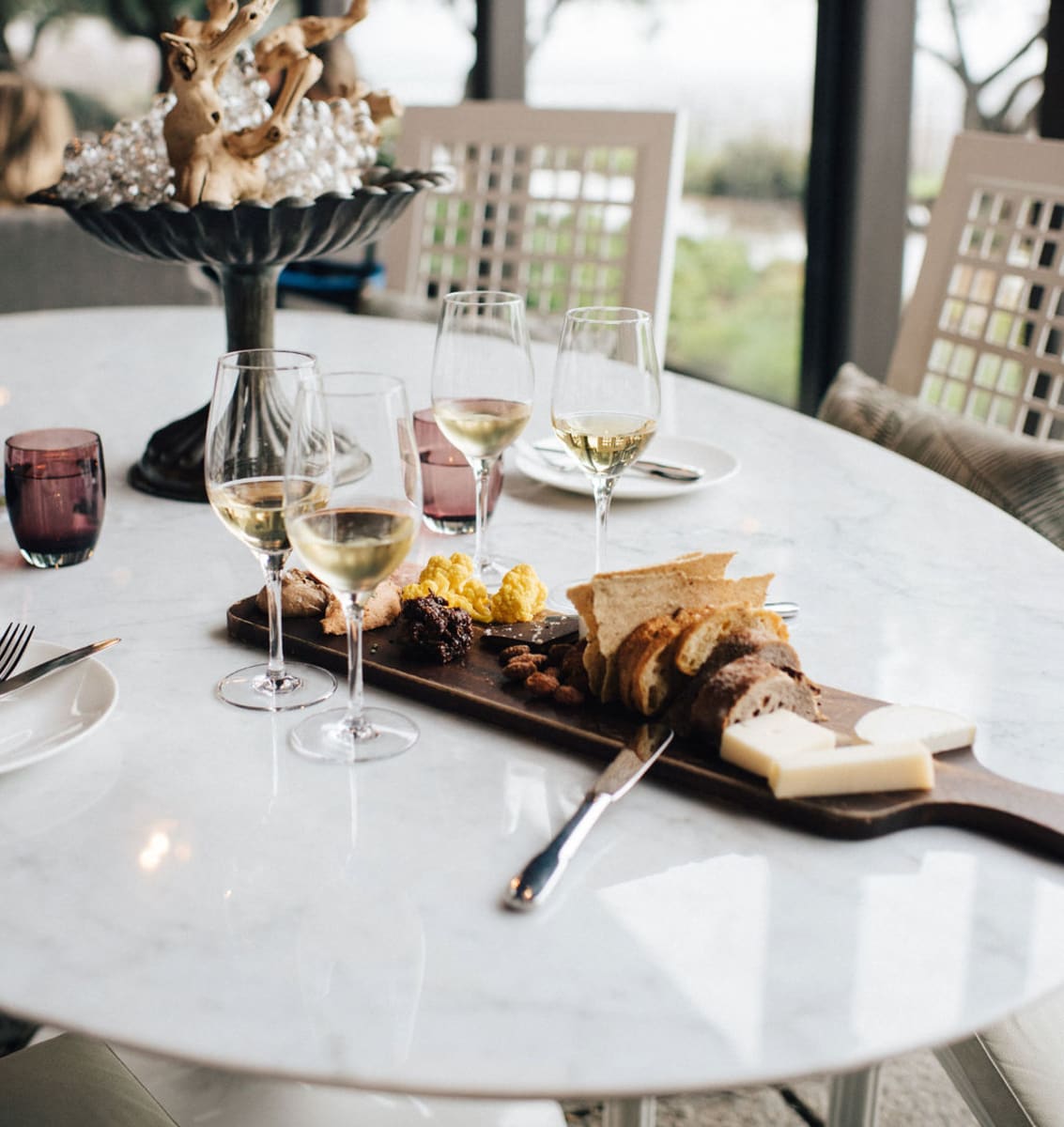 Table with wine glasses and appetizers