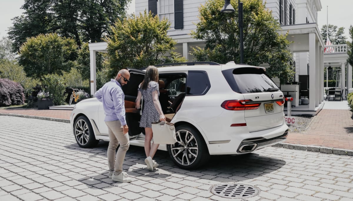 Couple entering BMW shuttle