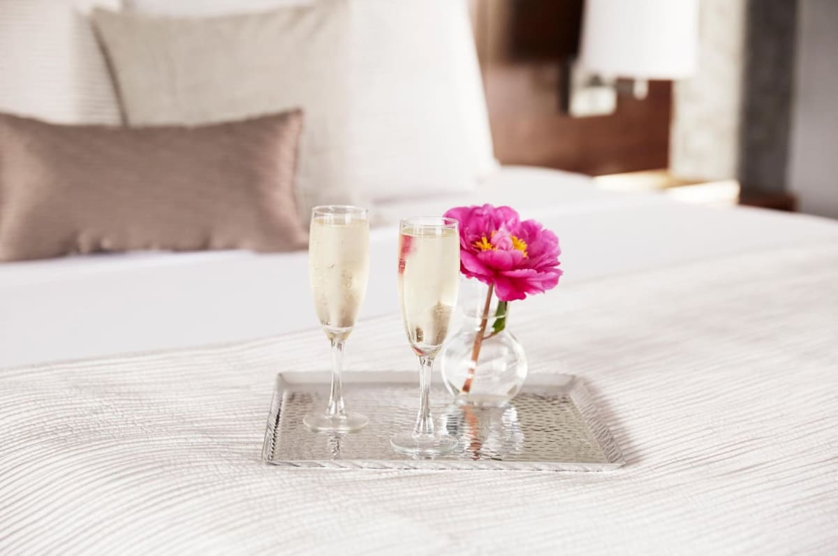 champagne on bed