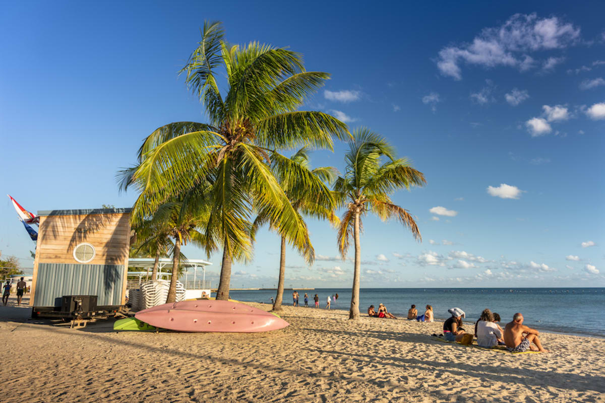 people-on-sand-of-smathers-beach-key-west