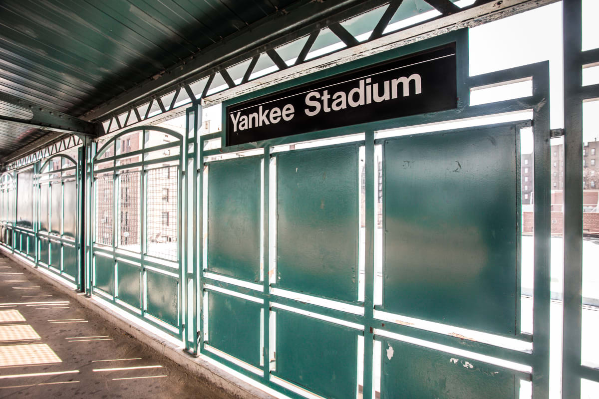 Yankee stadium station. Sign for Yankee Stadium and an empty platform 