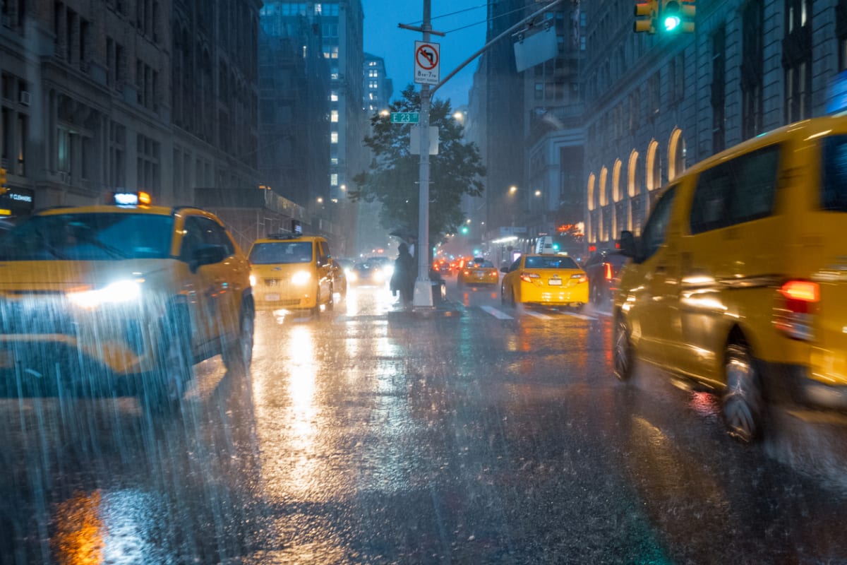 new york taxis drive through the rain 