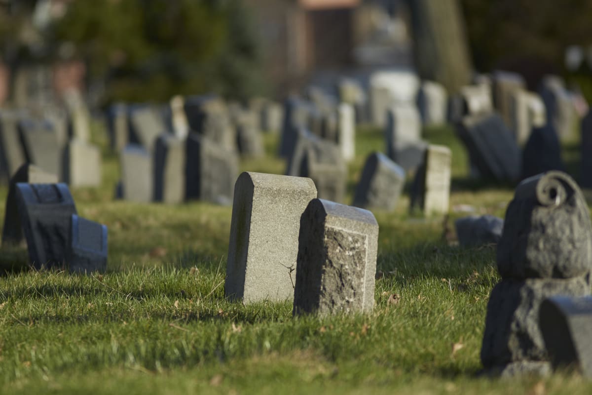 Old grave stones in a grave yard or cemetery in New York  