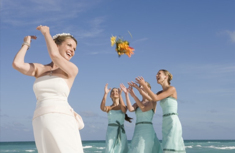 bride-throws-bouquet-to-bridesmaids