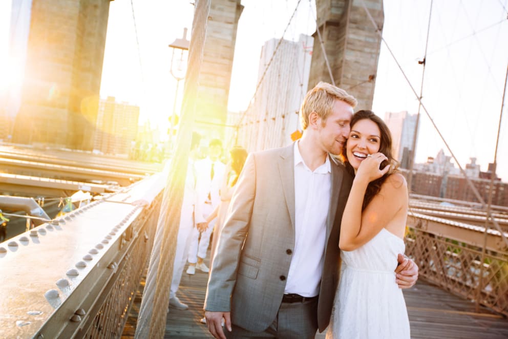 young-happy-on-brooklyn-bridge-just-engaged
