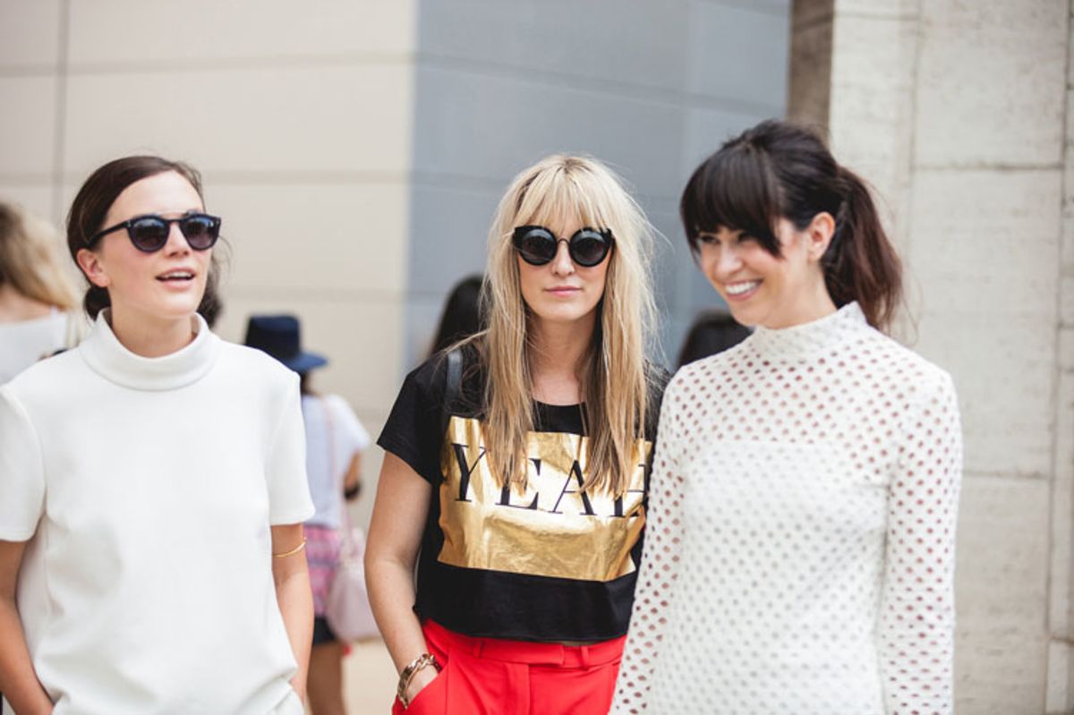 three-young-women-standing-wearing-trendy-casual-outfits