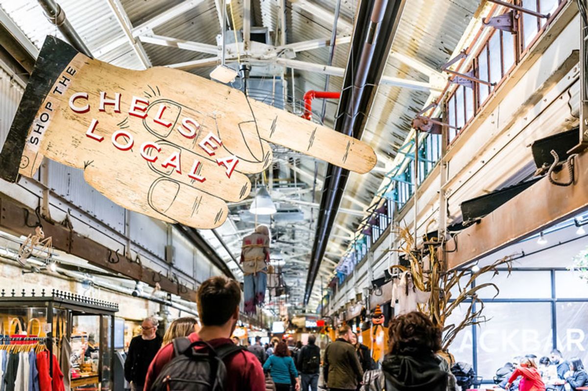 Sign reading Chelsea Local at Chelsea Market in New York.