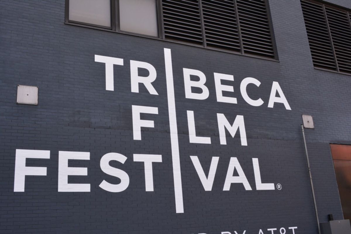 Black building with white letters advertising Tribeca Film Festival.