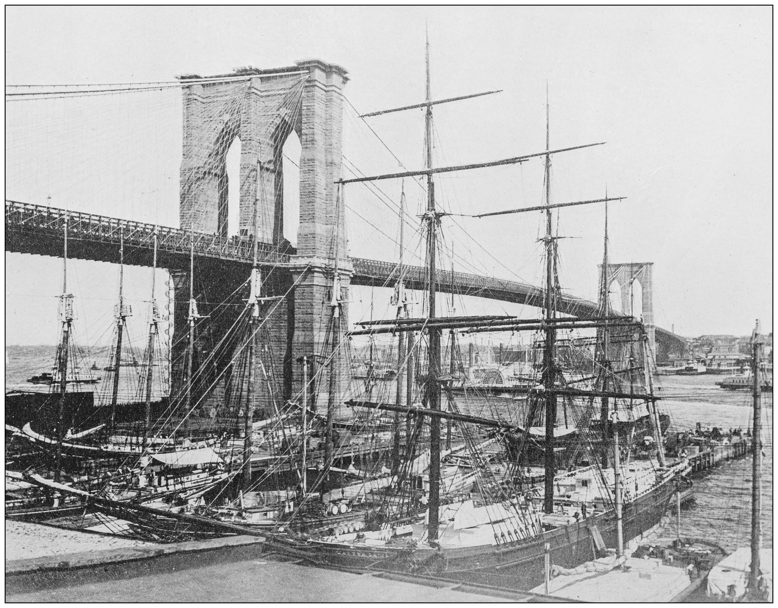 old picture of brooklyn bridge in black and white 