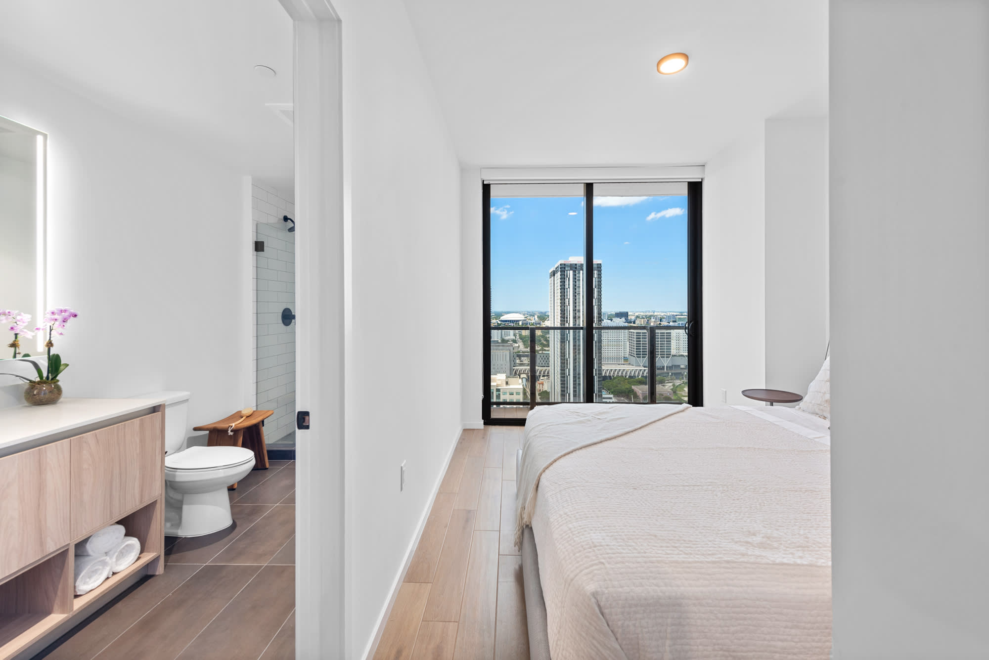 City View One Bedroom Suite at The Elser Hotel Miami featuring ensuite bathroom, King bed, and floor-to-ceiling skyline views
