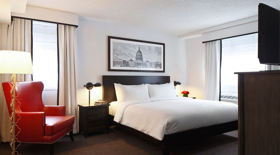 Junior Suite king bed with TV and chair