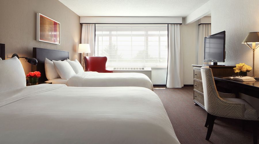 Superior Suite with two queen beds, TV, desk and chair