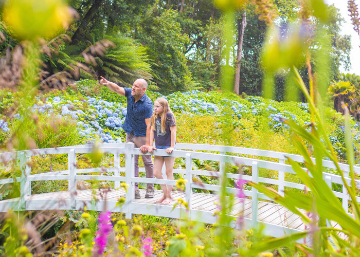 Man and daughter on trebah bridge