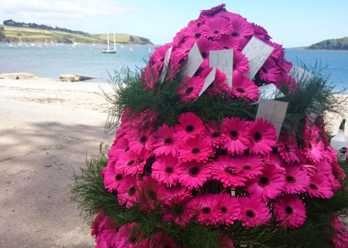 Reflections remembrance raft on Trebah beach