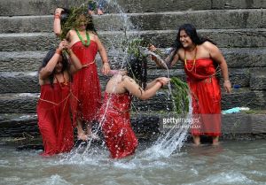 Women bathing in river during Teej festival in Nepal.
