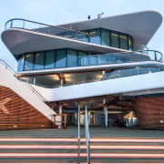 The stern's terraces cascade down to the water's teal