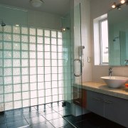 The view of a bathroom featuring bubbled glass bathroom, ceiling, floor, glass, home, interior design, plumbing fixture, room, tile, window, gray