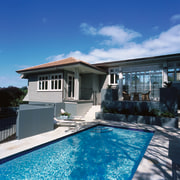 Pool area of weatherboard house with landscaped gardens backyard, estate, facade, home, house, property, real estate, residential area, roof, sky, swimming pool, villa, window, teal