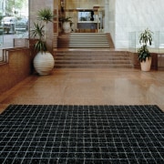 large mat in entrance area to protect tiled floor, flooring, road surface, tile, black, brown
