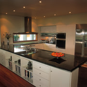 An example of a kitchen designed, manufactured and cabinetry, countertop, interior design, kitchen, room, brown