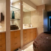 The view of a bathroom showing the lighting bathroom, cabinetry, countertop, interior design, kitchen, room, brown, orange