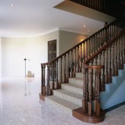 Entranceway with stone flooring, and sisal floor covering baluster, floor, flooring, handrail, hardwood, interior design, lobby, property, real estate, stairs, gray