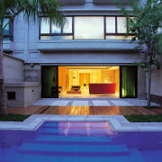 A view of a pool area outside the architecture, building, estate, facade, home, house, property, real estate, residential area, villa, window, blue