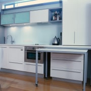 Kitchen with white cabinetry and benchtop, brushed aluminium cabinetry, countertop, desk, furniture, kitchen, product, product design, gray