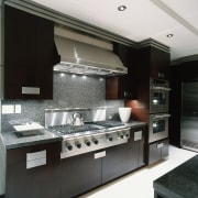 Close view of the cooking area - Close countertop, home appliance, interior design, kitchen, kitchen stove, black, white