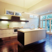 Kitchen with light cream coloured cabinetry and benchtops, cabinetry, ceiling, countertop, cuisine classique, floor, flooring, hardwood, interior design, kitchen, real estate, room, wood flooring, orange