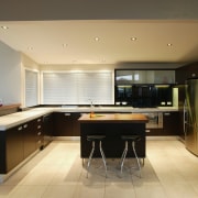 Kitchen with dark brown cabinetry, white benchtops, timber cabinetry, countertop, floor, flooring, interior design, kitchen, real estate, room