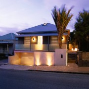 Exterior of house showing road frontage with lights architecture, building, cottage, elevation, estate, evening, facade, home, house, lighting, property, real estate, residential area, roof, siding, suburb, window, blue, purple