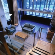 View from the mezzanine down into the lounge, interior design, living room, room, black, blue