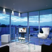 A photograph of a living room featuring a architecture, blue, ceiling, condominium, interior design, living room, real estate, window, blue