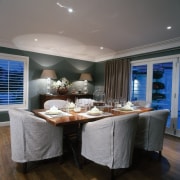 A view of the dining table area with ceiling, dining room, interior design, table, gray, black