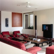 A view of the lounge area with the ceiling, floor, furniture, home, interior design, living room, property, real estate, room, table, gray, red