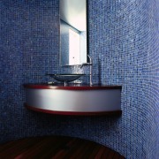 A view of the bathroom area with the architecture, bathroom, floor, flooring, glass, interior design, purple, room, tile, wall, blue