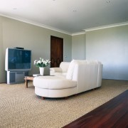 view of the lounge showing textured carpet from ceiling, floor, flooring, furniture, hardwood, interior design, laminate flooring, living room, property, real estate, room, wall, wood, wood flooring, gray