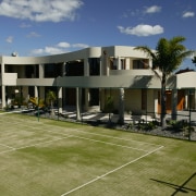 A house with a tennis court &amp; landscaping architecture, estate, facade, home, house, property, real estate, residential area, brown