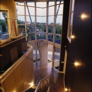 Interior view of the entrance to this home architecture, daylighting, handrail, home, house, interior design, lighting, property, real estate, stairs, window, black, brown