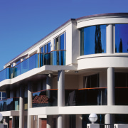 Inner view of a house featuring curved balustrades apartment, architecture, building, commercial building, condominium, corporate headquarters, elevation, facade, home, house, mixed use, property, real estate, residential area, sky, window, blue, black