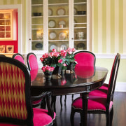 Bold color scheme. Dining room furniture hass been chair, dining room, furniture, home, interior design, kitchen & dining room table, living room, room, table, wall, window, window covering, orange, black