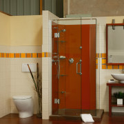 A bathroom featuring an orange coloured glass shower. bathroom, bathroom accessory, floor, interior design, plumbing fixture, room, toilet, brown, orange