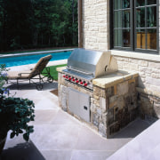 View of the outdoor appliance - View of backyard, outdoor furniture, outdoor structure, patio, wall, black, gray