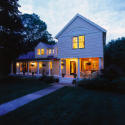 View of the home in evening, showing lighting, architecture, building, cottage, estate, evening, facade, farmhouse, home, house, lighting, mansion, property, real estate, residential area, siding, sky, suburb, window, black