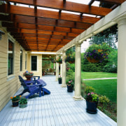 View of the front patio with pergola and backyard, deck, home, house, outdoor structure, patio, pergola, porch, real estate, roof, yard