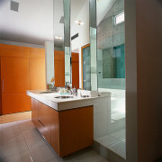 View of a bathroom, tiled flooring, wooden vanity, architecture, bathroom, cabinetry, countertop, interior design, kitchen, room, sink, brown