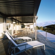 Timber deck outside house, with outdoor furniture, and architecture, daylighting, house, property, real estate, black