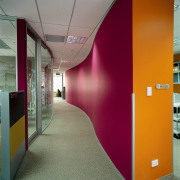Corridor on office floor with curved purple and architecture, ceiling, floor, glass, interior design, office, wall, gray