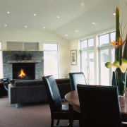 View of dining &amp; living space - View ceiling, dining room, fireplace, floor, flooring, hearth, home, interior design, living room, real estate, room, wall, gray